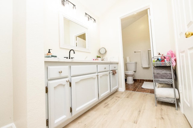 5263 W Griffith Way, Fresno, CA 93722 - bathroom featuring vanity and wood finished floors