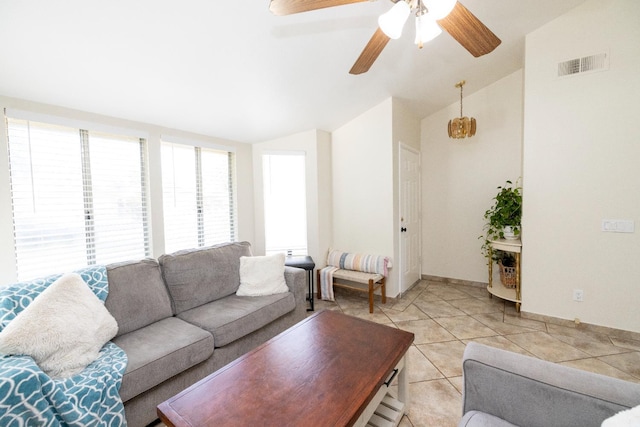 5263 W Griffith Way, Fresno, CA 93722 - living room with vaulted ceiling, a ceiling fan, and light tile patterned floors