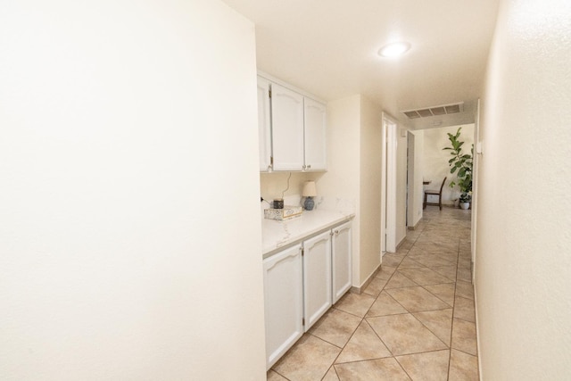 5263 W Griffith Way, Fresno, CA 93722 - hallway with light tile patterned flooring