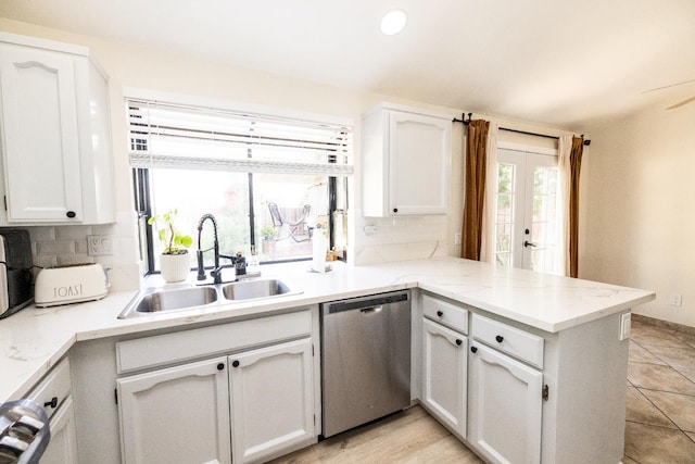 5263 W Griffith Way, Fresno, CA 93722 - kitchen with dishwasher, a peninsula, tasteful backsplash, white cabinets, and recessed lighting