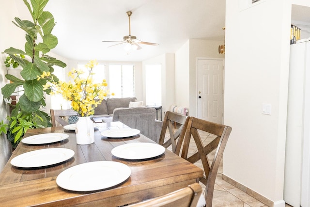 5263 W Griffith Way, Fresno, CA 93722 - dining space with ceiling fan and light tile patterned flooring