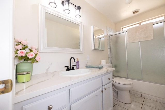 5263 W Griffith Way, Fresno, CA 93722 - full bathroom featuring vanity, enclosed tub / shower combo, and tile patterned flooring