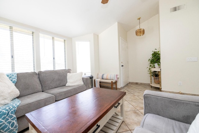 5263 W Griffith Way, Fresno, CA 93722 - living room with light tile patterned floors, lofted ceiling, and a ceiling fan