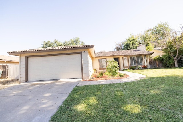 5263 W Griffith Way, Fresno, CA 93722 - ranch-style house featuring driveway, a chimney, a tile roof, an attached garage, and stucco siding