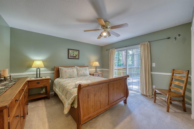 42055 Saddleback Rd, Shaver Lake, CA 93664 - bedroom featuring access to exterior, light carpet, and a ceiling fan