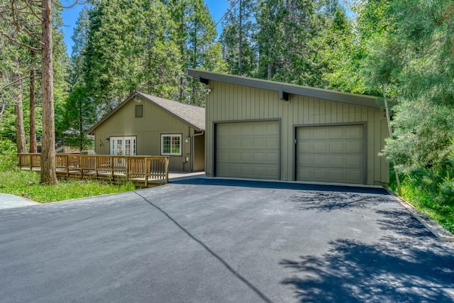 42055 Saddleback Rd, Shaver Lake, CA 93664 - view of front of property with a deck, french doors, and a garage