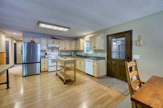 42055 Saddleback Rd, Shaver Lake, CA 93664 - kitchen with white appliances, a textured ceiling, light wood-style flooring, under cabinet range hood, and dark countertops