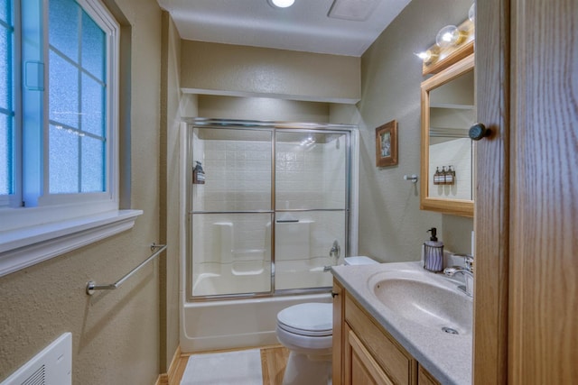42055 Saddleback Rd, Shaver Lake, CA 93664 - full bath with vanity, bath / shower combo with glass door, and a textured wall