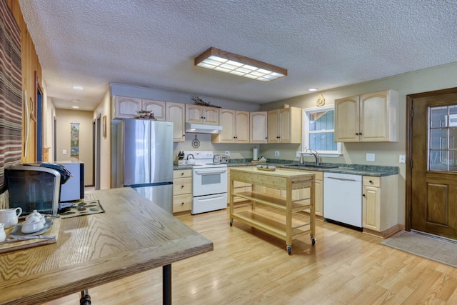 42055 Saddleback Rd, Shaver Lake, CA 93664 - kitchen featuring white appliances, a textured ceiling, light wood-style flooring, under cabinet range hood, and light brown cabinets
