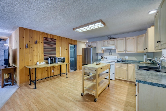 42055 Saddleback Rd, Shaver Lake, CA 93664 - kitchen with stainless steel appliances, under cabinet range hood, a textured ceiling, light wood-style floors, and wood walls