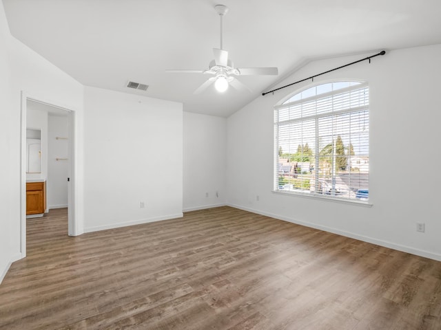 180 N Anderson Ave, Clovis, CA 93612 - empty room featuring ceiling fan, vaulted ceiling, and wood finished floors