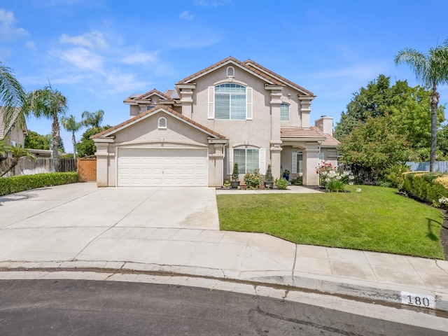 180 N Anderson Ave, Clovis, CA 93612 - view of front of home featuring stucco siding, driveway, an attached garage, and a tile roof