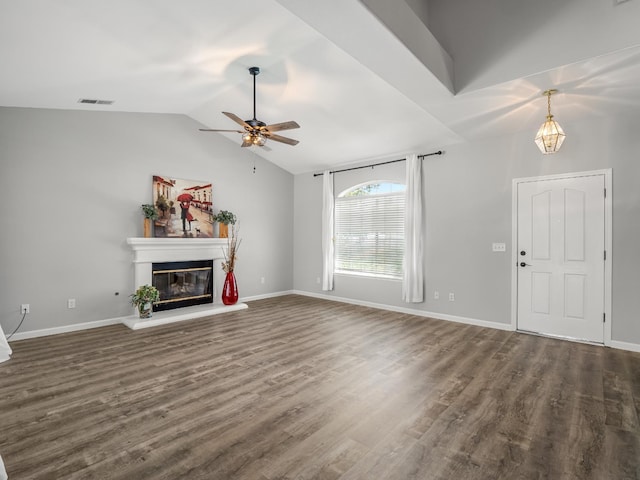 180 N Anderson Ave, Clovis, CA 93612 - unfurnished living room with a glass covered fireplace, a ceiling fan, dark wood-style floors, and vaulted ceiling