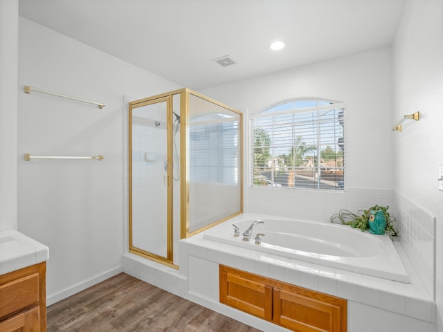 180 N Anderson Ave, Clovis, CA 93612 - bathroom featuring a garden tub, a stall shower, vanity, wood finished floors, and recessed lighting