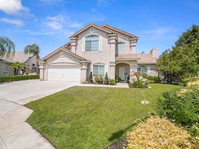 180 N Anderson Ave, Clovis, CA 93612 - mediterranean / spanish-style home with stucco siding, driveway, a front lawn, a tiled roof, and a garage