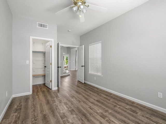 180 N Anderson Ave, Clovis, CA 93612 - unfurnished bedroom featuring wood finished floors, a walk in closet, a closet, and ceiling fan