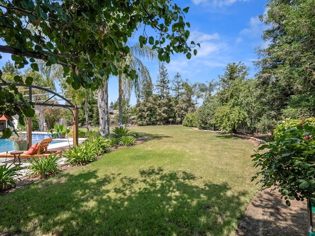180 N Anderson Ave, Clovis, CA 93612 - view of grassy yard with an outdoor pool