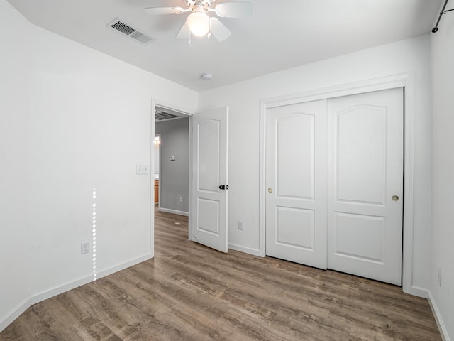 180 N Anderson Ave, Clovis, CA 93612 - unfurnished bedroom featuring wood finished floors, a closet, and ceiling fan