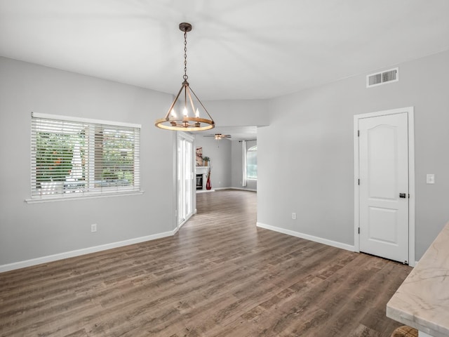 180 N Anderson Ave, Clovis, CA 93612 - unfurnished dining area with a ceiling fan, wood finished floors, and a fireplace