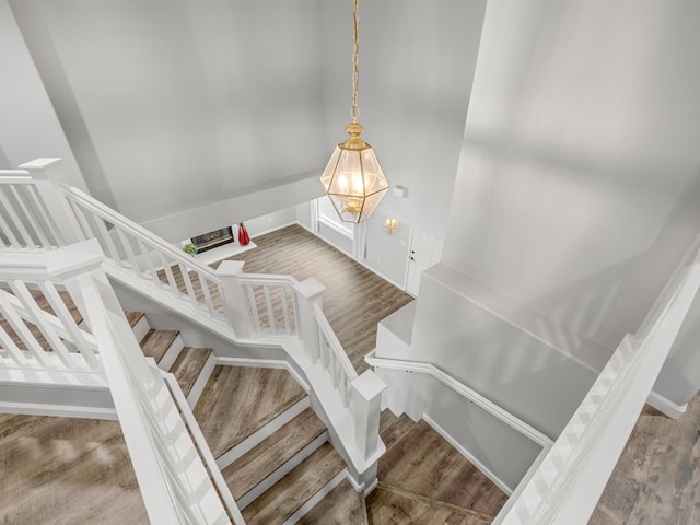 180 N Anderson Ave, Clovis, CA 93612 - stairway with wood finished floors and a chandelier