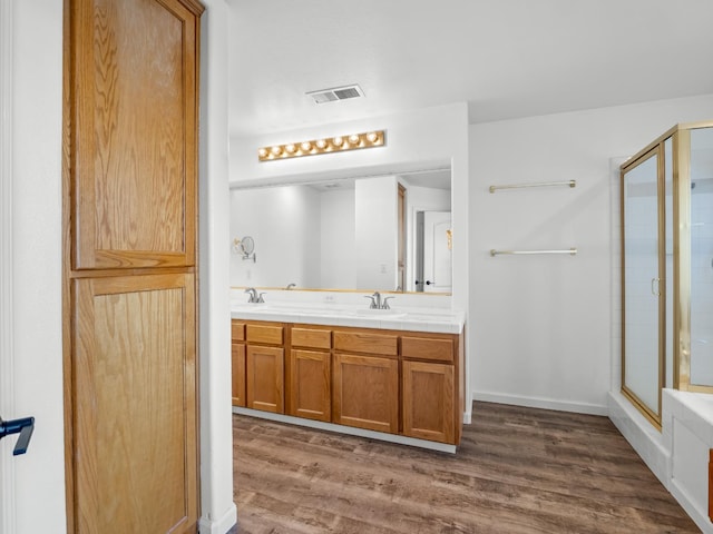 180 N Anderson Ave, Clovis, CA 93612 - full bath featuring a stall shower, double vanity, and wood finished floors