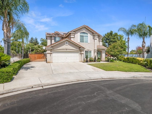 180 N Anderson Ave, Clovis, CA 93612 - view of front of property featuring stucco siding, solar panels, a garage, concrete driveway, and a tiled roof