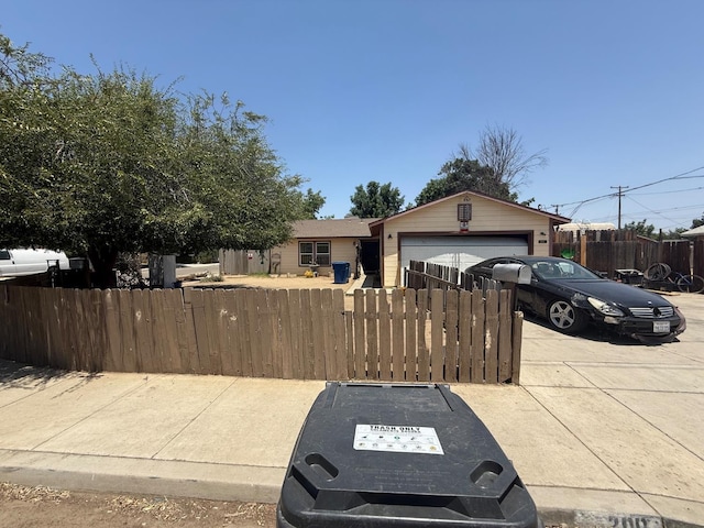 200 E Warren Ave, Bakersfield, CA 93308 - ranch-style home with a fenced front yard and an attached garage