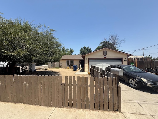 200 E Warren Ave, Bakersfield, CA 93308 - ranch-style house with a fenced front yard, a garage, and concrete driveway