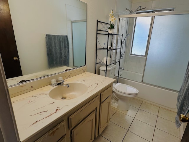 3043 N Brunswick Ave, Fresno, CA 93722 - full bathroom featuring vanity, enclosed tub / shower combo, and tile patterned flooring