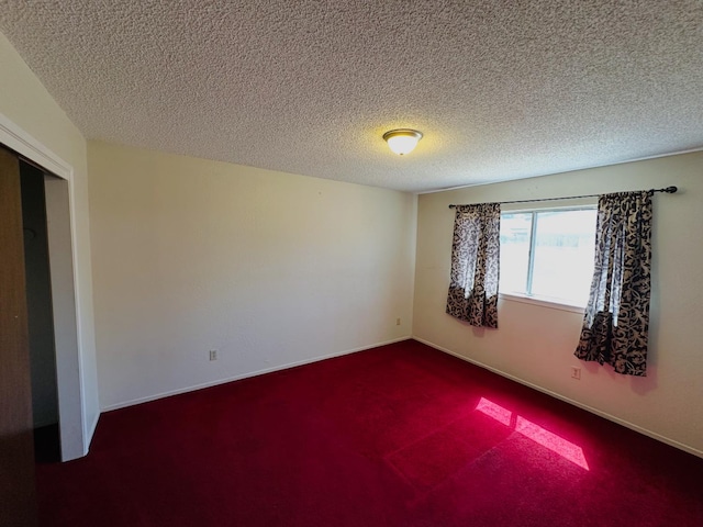 3043 N Brunswick Ave, Fresno, CA 93722 - spare room with dark colored carpet and a textured ceiling