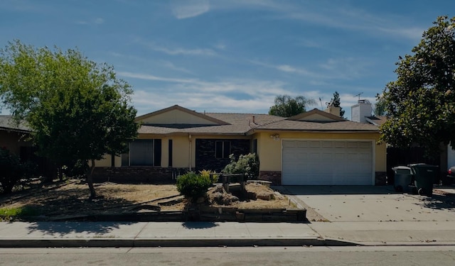3043 N Brunswick Ave, Fresno, CA 93722 - ranch-style house with an attached garage and concrete driveway