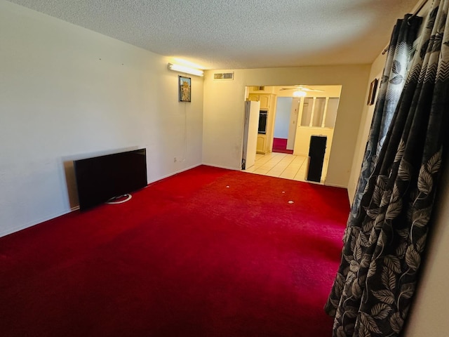 3043 N Brunswick Ave, Fresno, CA 93722 - spare room featuring light colored carpet and a textured ceiling