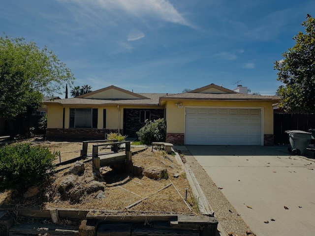 3043 N Brunswick Ave, Fresno, CA 93722 - single story home with brick siding, a garage, and driveway