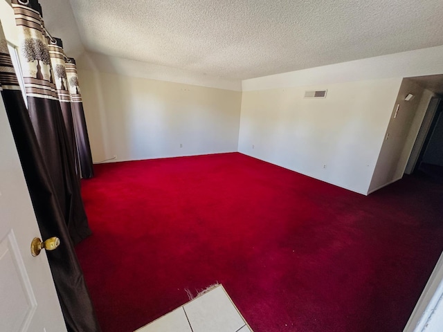 3043 N Brunswick Ave, Fresno, CA 93722 - spare room featuring carpet flooring and a textured ceiling