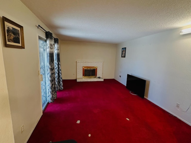 3043 N Brunswick Ave, Fresno, CA 93722 - unfurnished living room with a brick fireplace, carpet flooring, and a textured ceiling