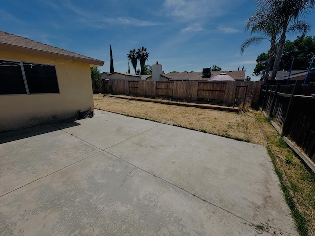 3043 N Brunswick Ave, Fresno, CA 93722 - fenced backyard with a patio area
