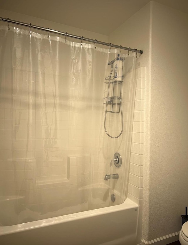 4542 N Casey Ave, Fresno, CA 93723 - bathroom featuring shower / tub combo with curtain and a textured wall