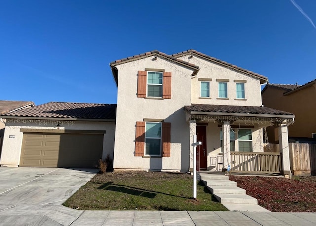 4542 N Casey Ave, Fresno, CA 93723 - view of front facade with a porch, an attached garage, concrete driveway, stucco siding, and a tile roof