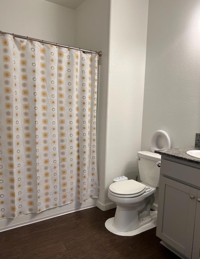 4542 N Casey Ave, Fresno, CA 93723 - bathroom featuring vanity, wood finished floors, and curtained shower