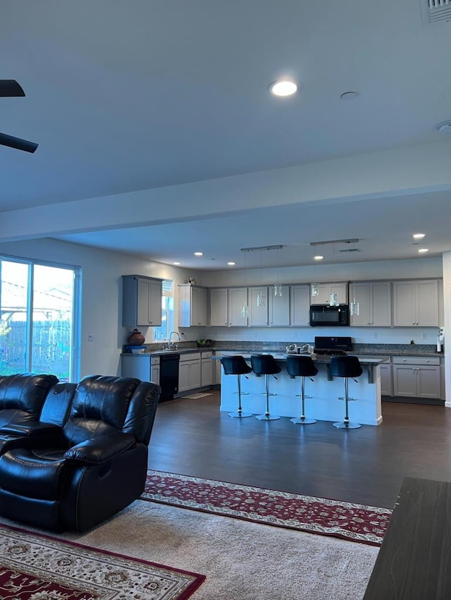 4542 N Casey Ave, Fresno, CA 93723 - living room with dark wood finished floors and recessed lighting