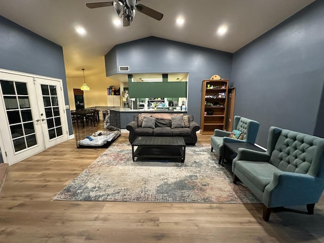 2526 Gibson Ave, Clovis, CA 93611 - living room featuring french doors, vaulted ceiling, wood finished floors, a ceiling fan, and recessed lighting
