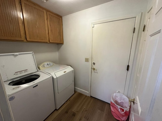 2526 Gibson Ave, Clovis, CA 93611 - laundry area featuring washer and clothes dryer, wood finished floors, and cabinet space