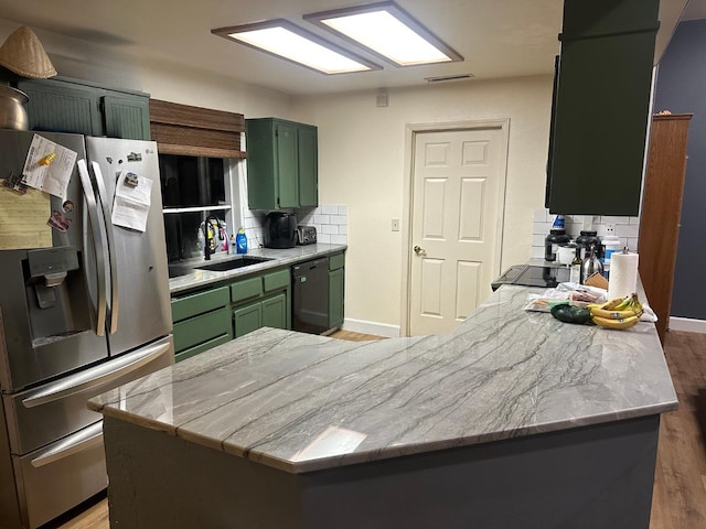 2526 Gibson Ave, Clovis, CA 93611 - kitchen with stainless steel fridge, green cabinetry, dishwasher, and light wood-type flooring