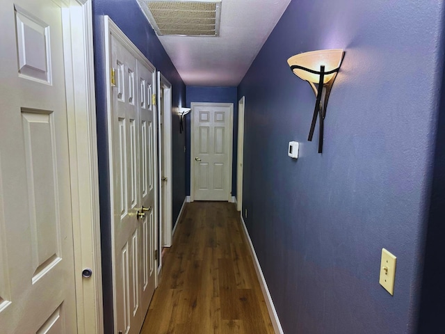 2526 Gibson Ave, Clovis, CA 93611 - hall with dark wood-style flooring and baseboards