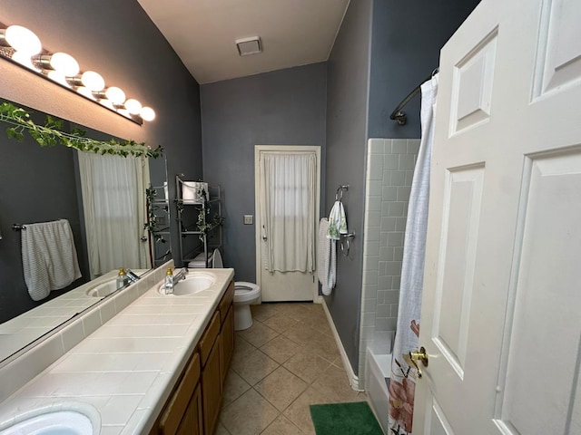 2526 Gibson Ave, Clovis, CA 93611 - bathroom with double vanity, tile patterned flooring, and shower / bath combo with shower curtain