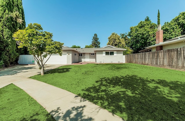 6683 N Spalding Ave, Fresno, CA 93710 - view of yard featuring concrete driveway and an attached garage