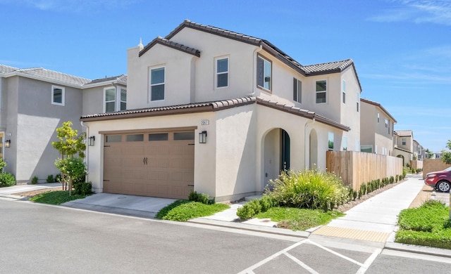 2047 N Ralph Ln, Clovis, CA 93619 - view of front of property with a tiled roof, stucco siding, a residential view, and a garage