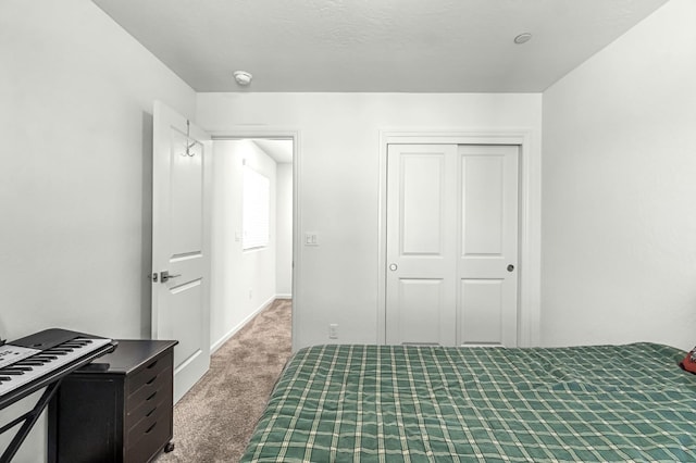 2047 N Ralph Ln, Clovis, CA 93619 - carpeted bedroom featuring a closet and baseboards