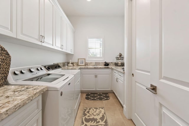 4693 Del Oro Rd, Madera, CA 93636 - washroom featuring separate washer and dryer, cabinet space, and light tile patterned flooring