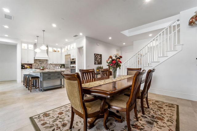 4693 Del Oro Rd, Madera, CA 93636 - dining room with recessed lighting, stairs, and light tile patterned floors